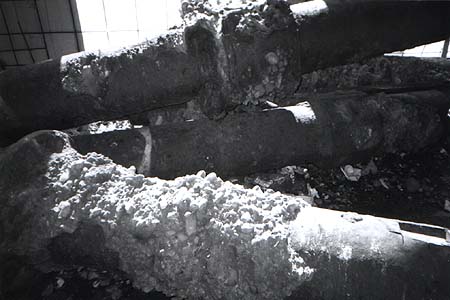 Under the chopped-off end of the pier